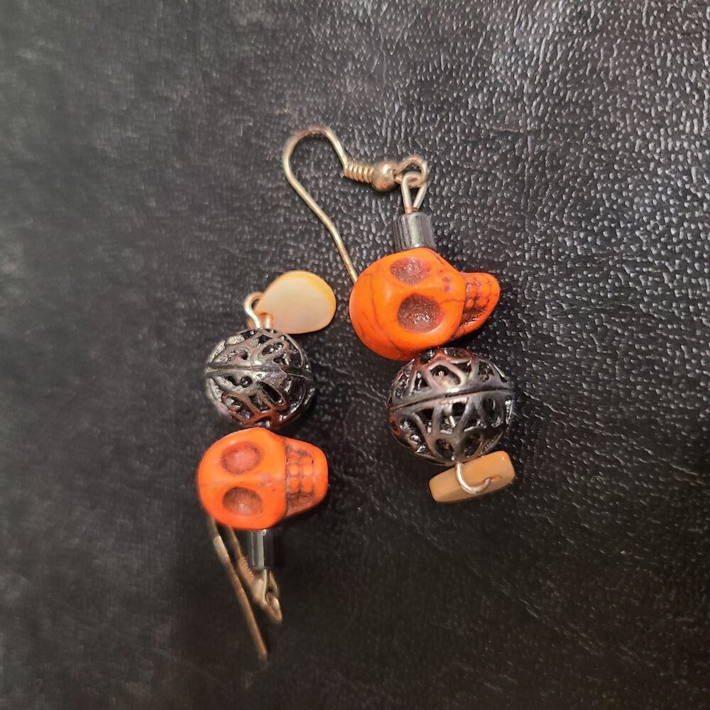 Handmade stone-carved orange skull dangle earring